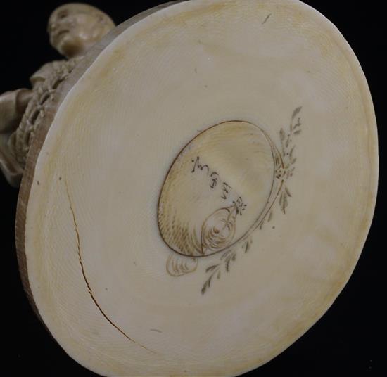 A Japanese ivory group of a man carrying two boys, Meiji period, height 16cm, age cracks and losses